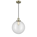 Beacon Mini Pendant shown in the Antique Brass finish with a Clear shade