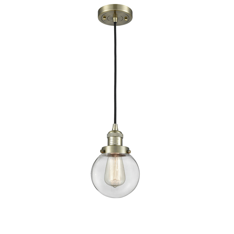 Beacon Mini Pendant shown in the Antique Brass finish with a Clear shade