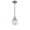 Beacon Mini Pendant shown in the Antique Brass finish with a Clear shade