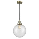 Beacon Mini Pendant shown in the Antique Brass finish with a Seedy shade