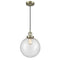 Beacon Mini Pendant shown in the Antique Brass finish with a Seedy shade