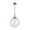 Beacon Mini Pendant shown in the Antique Brass finish with a Seedy shade