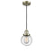 Beacon Mini Pendant shown in the Antique Brass finish with a Seedy shade