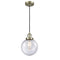 Beacon Mini Pendant shown in the Antique Brass finish with a Seedy shade