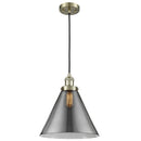 Cone Mini Pendant shown in the Antique Brass finish with a Plated Smoke shade