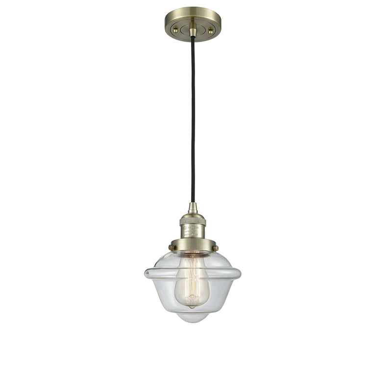 Oxford Mini Pendant shown in the Antique Brass finish with a Clear shade