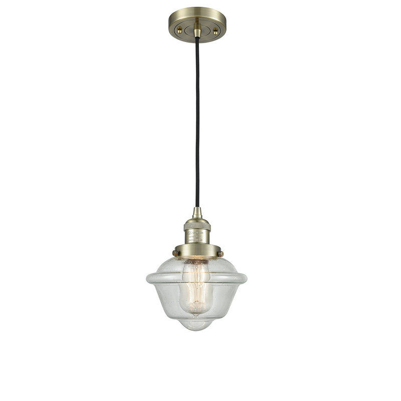 Oxford Mini Pendant shown in the Antique Brass finish with a Seedy shade