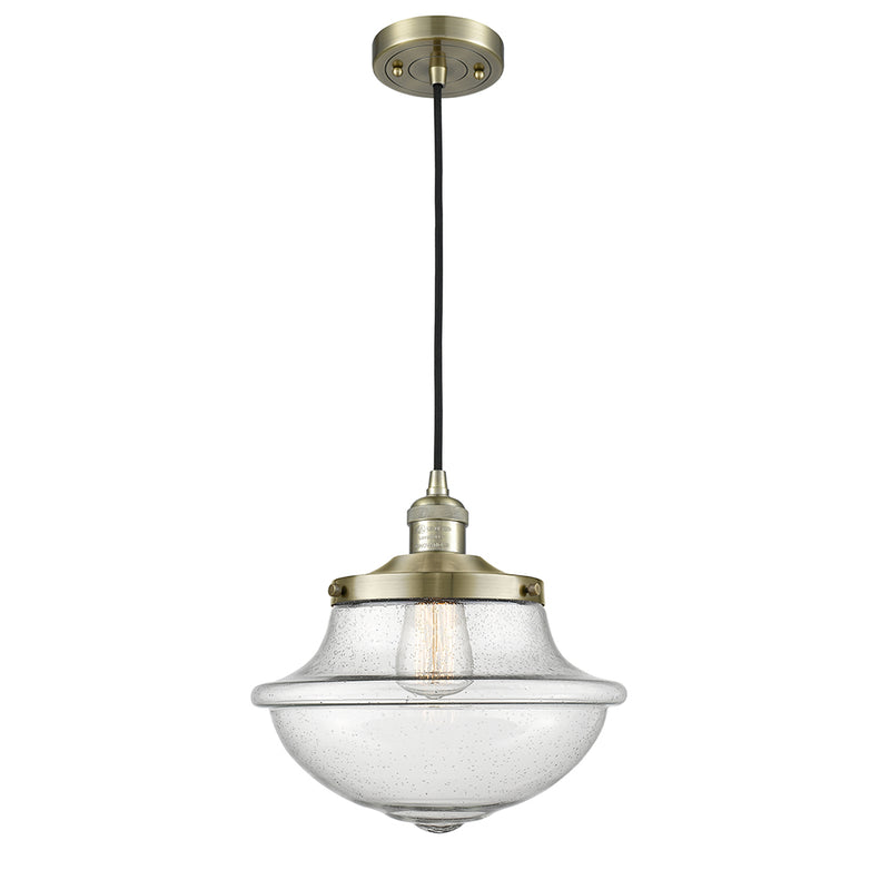 Oxford Mini Pendant shown in the Antique Brass finish with a Seedy shade