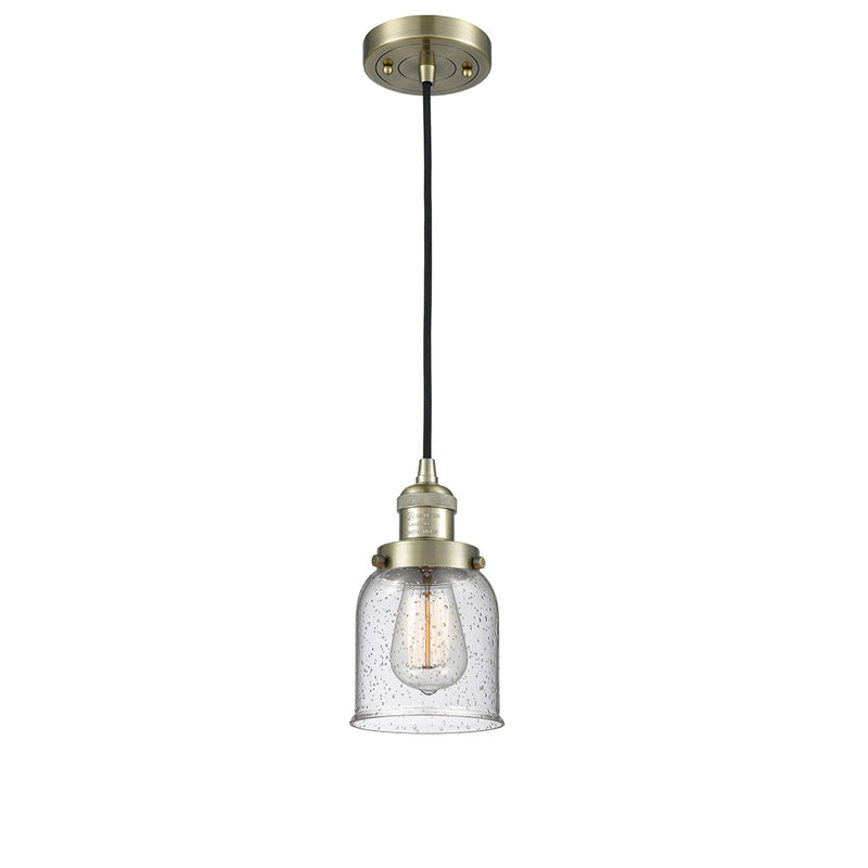 Bell Mini Pendant shown in the Antique Brass finish with a Seedy shade