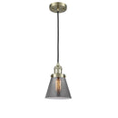 Cone Mini Pendant shown in the Antique Brass finish with a Plated Smoke shade