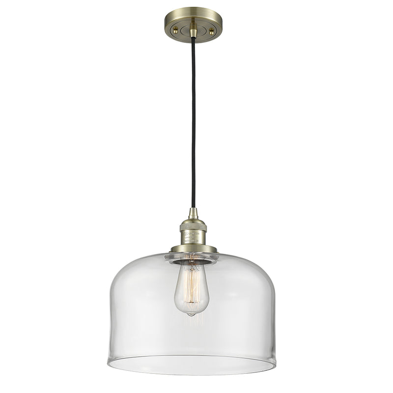 Bell Mini Pendant shown in the Antique Brass finish with a Clear shade