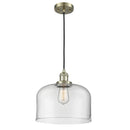 Bell Mini Pendant shown in the Antique Brass finish with a Clear shade