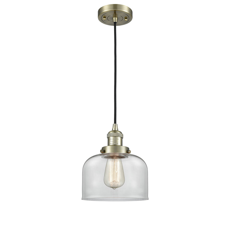 Bell Mini Pendant shown in the Antique Brass finish with a Clear shade