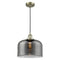 Bell Mini Pendant shown in the Antique Brass finish with a Plated Smoke shade