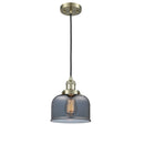 Bell Mini Pendant shown in the Antique Brass finish with a Plated Smoke shade