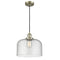 Bell Mini Pendant shown in the Antique Brass finish with a Seedy shade