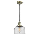 Bell Mini Pendant shown in the Antique Brass finish with a Seedy shade