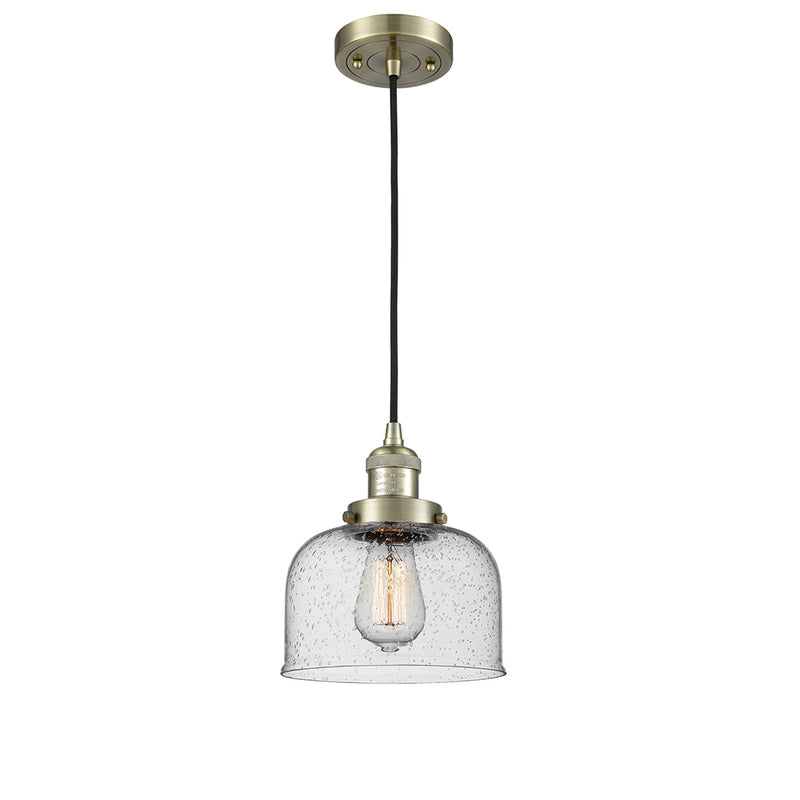 Bell Mini Pendant shown in the Antique Brass finish with a Seedy shade