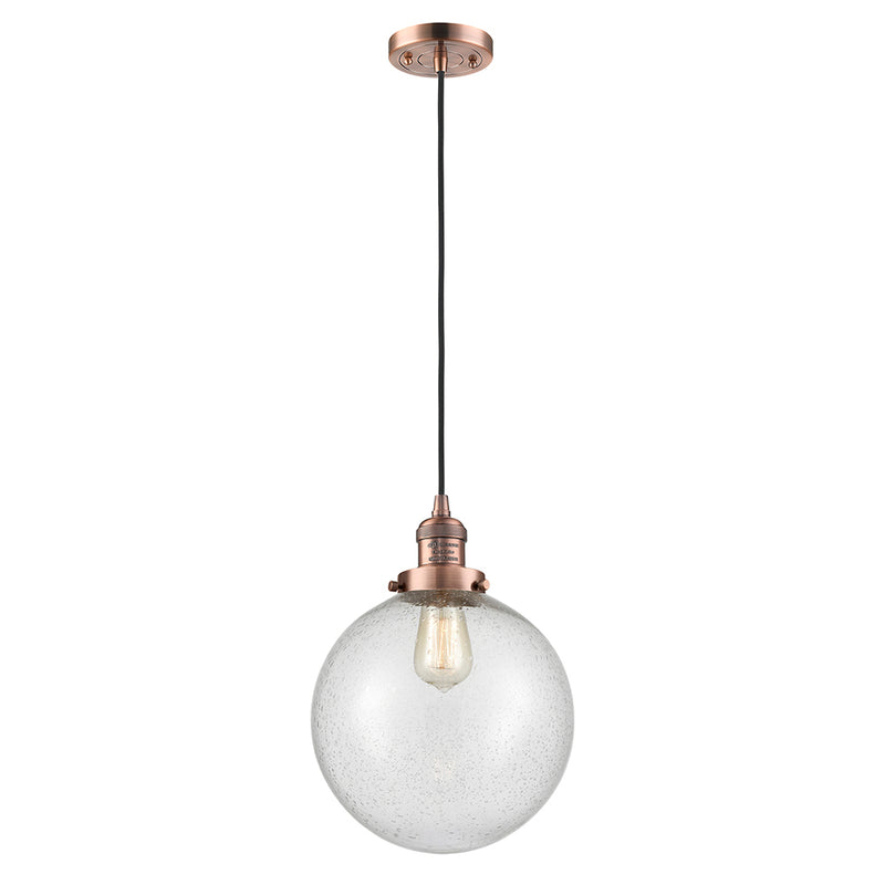 Beacon Mini Pendant shown in the Antique Copper finish with a Seedy shade