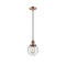 Beacon Mini Pendant shown in the Antique Copper finish with a Seedy shade