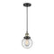 Beacon Mini Pendant shown in the Black Antique Brass finish with a Seedy shade