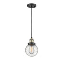 Beacon Mini Pendant shown in the Black Antique Brass finish with a Seedy shade