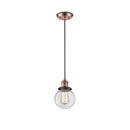 Beacon Mini Pendant shown in the Antique Copper finish with a Clear shade