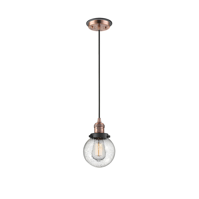 Beacon Mini Pendant shown in the Antique Copper finish with a Seedy shade