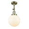 Beacon Semi-Flush Mount shown in the Antique Brass finish with a Matte White shade