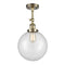 Beacon Semi-Flush Mount shown in the Antique Brass finish with a Clear shade