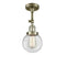 Beacon Semi-Flush Mount shown in the Antique Brass finish with a Clear shade