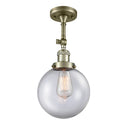 Beacon Semi-Flush Mount shown in the Antique Brass finish with a Clear shade