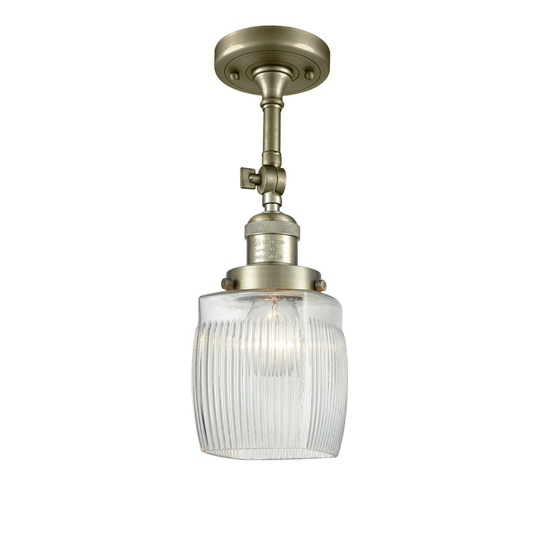 Colton Semi-Flush Mount shown in the Antique Brass finish with a Clear Halophane shade