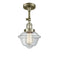 Oxford Semi-Flush Mount shown in the Antique Brass finish with a Clear shade