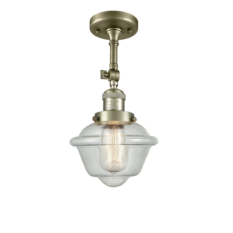 Oxford Semi-Flush Mount shown in the Antique Brass finish with a Seedy shade