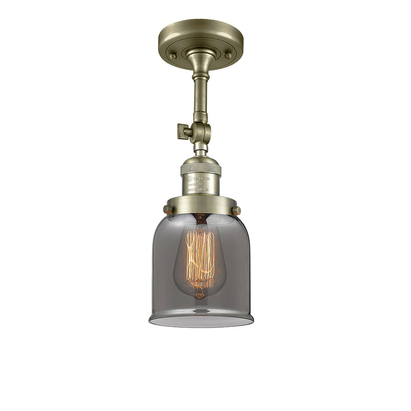 Bell Semi-Flush Mount shown in the Antique Brass finish with a Plated Smoke shade