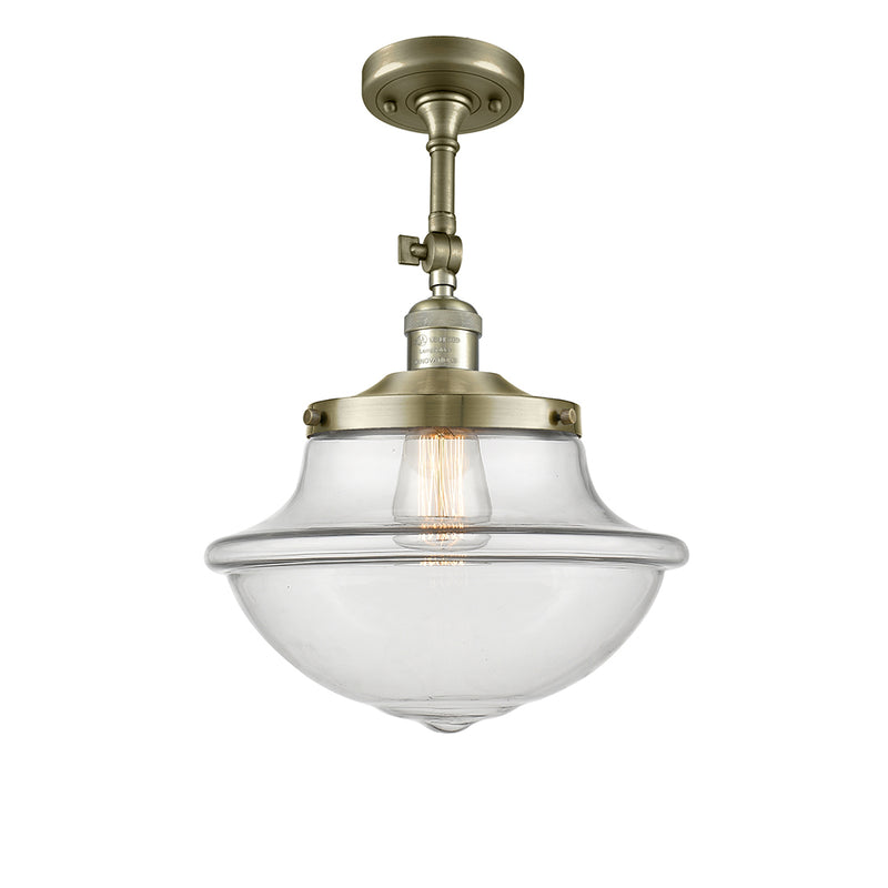 Oxford Semi-Flush Mount shown in the Antique Brass finish with a Clear shade