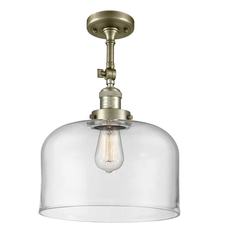 Bell Semi-Flush Mount shown in the Antique Brass finish with a Clear shade