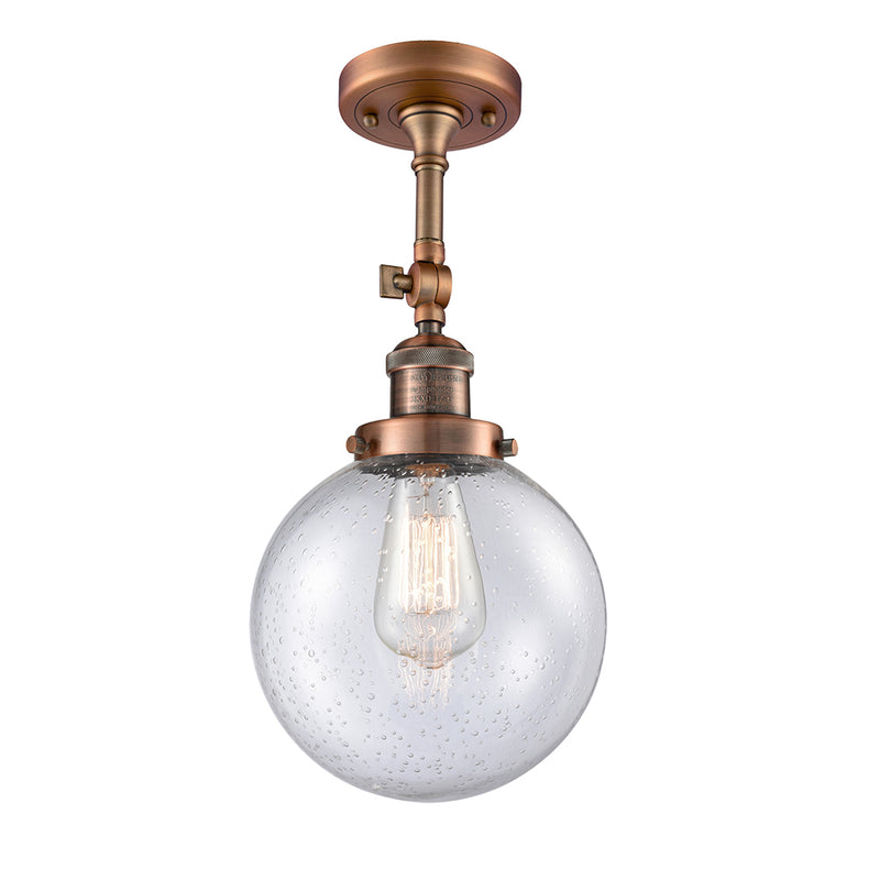 Beacon Semi-Flush Mount shown in the Antique Copper finish with a Seedy shade