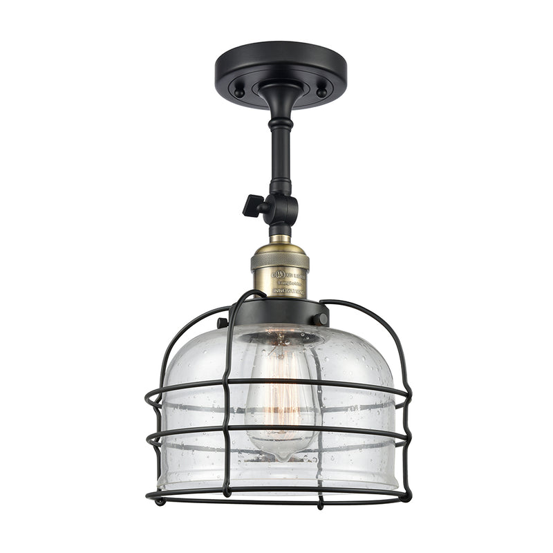 Bell Cage Semi-Flush Mount shown in the Black Antique Brass finish with a Seedy shade