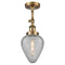 Geneseo Semi-Flush Mount shown in the Brushed Brass finish with a Clear Crackled shade