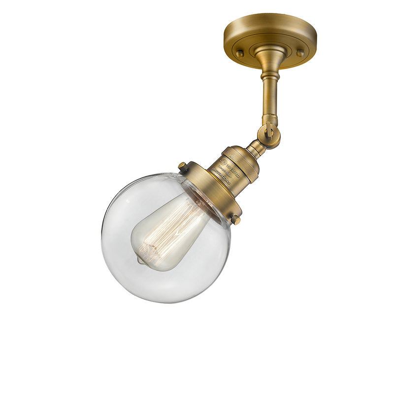 Beacon Semi-Flush Mount shown in the Brushed Brass finish with a Clear shade