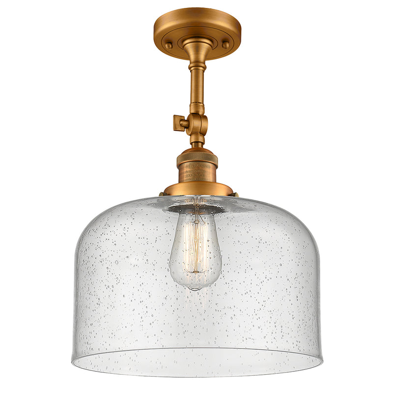 Bell Semi-Flush Mount shown in the Brushed Brass finish with a Seedy shade