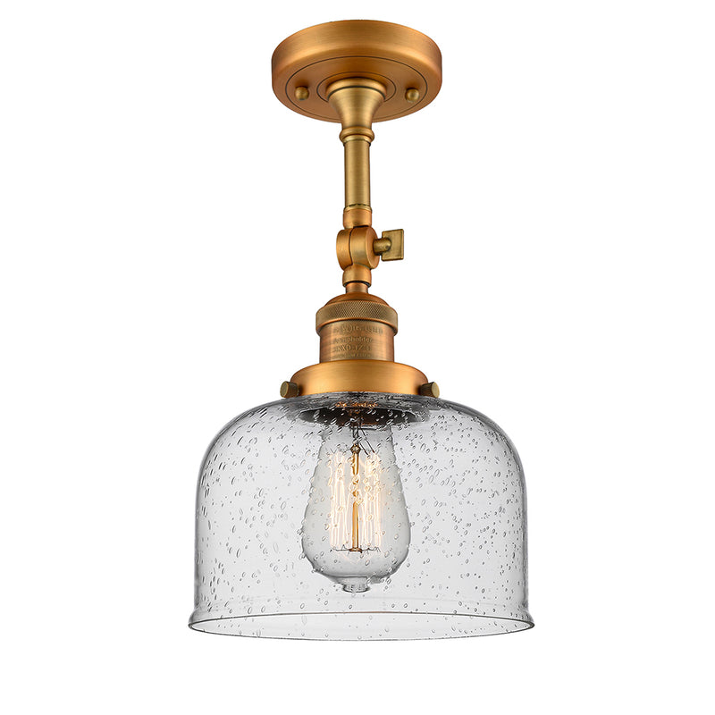 Bell Semi-Flush Mount shown in the Brushed Brass finish with a Seedy shade