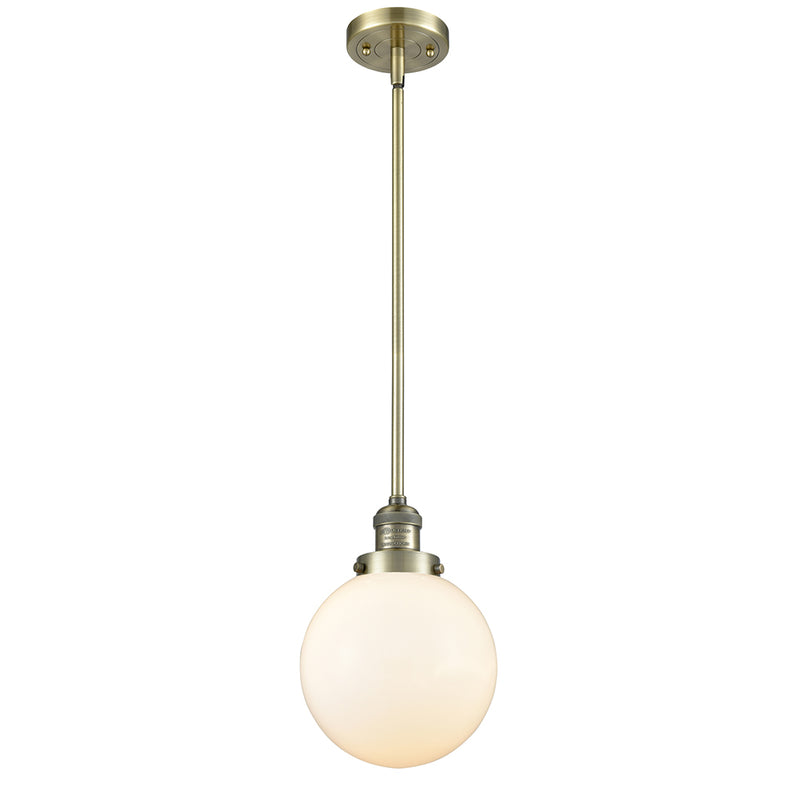 Beacon Mini Pendant shown in the Antique Brass finish with a Matte White shade