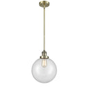 Beacon Mini Pendant shown in the Antique Brass finish with a Clear shade