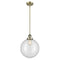 Beacon Mini Pendant shown in the Antique Brass finish with a Clear shade