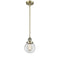 Beacon Mini Pendant shown in the Antique Brass finish with a Clear shade