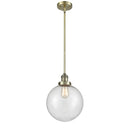 Beacon Mini Pendant shown in the Antique Brass finish with a Seedy shade