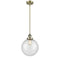 Beacon Mini Pendant shown in the Antique Brass finish with a Seedy shade